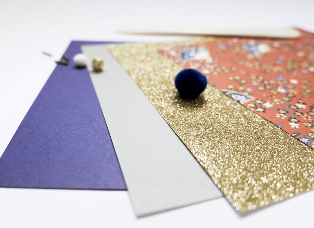 Pretty paper, some beads, some thread, a little bell