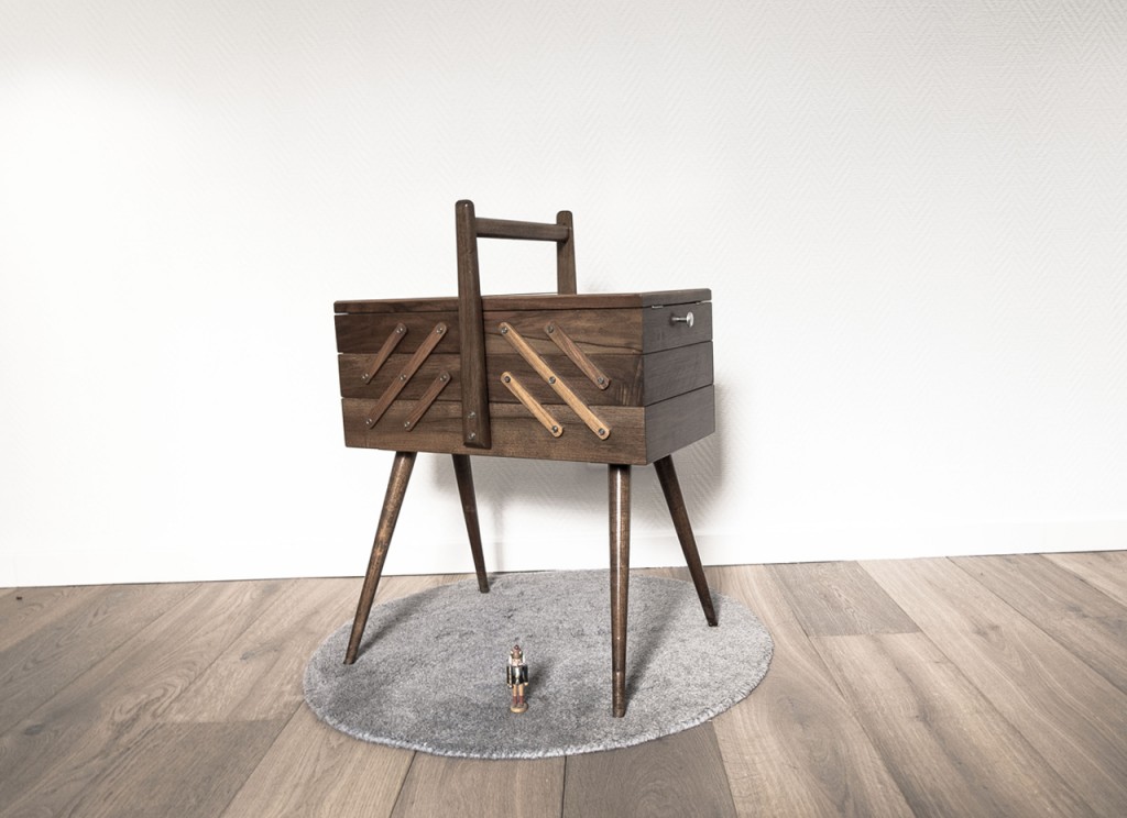 Sewing table in dark wood, white background