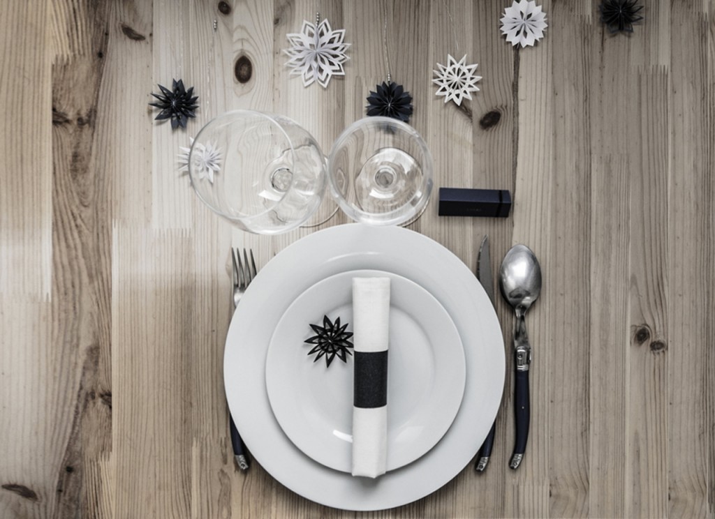 Festive table decoration with paper snowflakes