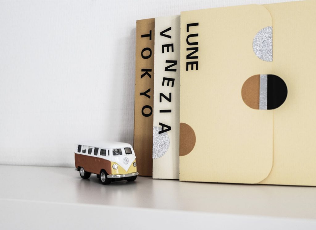 Homemade Travel Books and mini-bus on the shelve