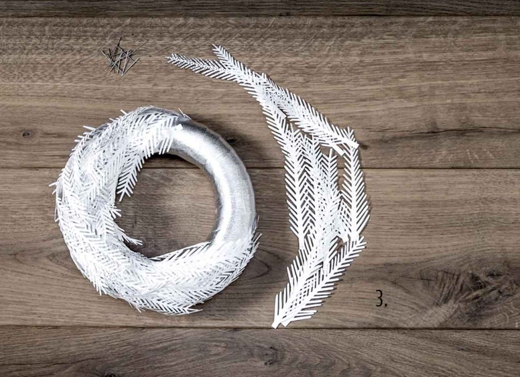 Make your own wreath with holly paper branches and leaves