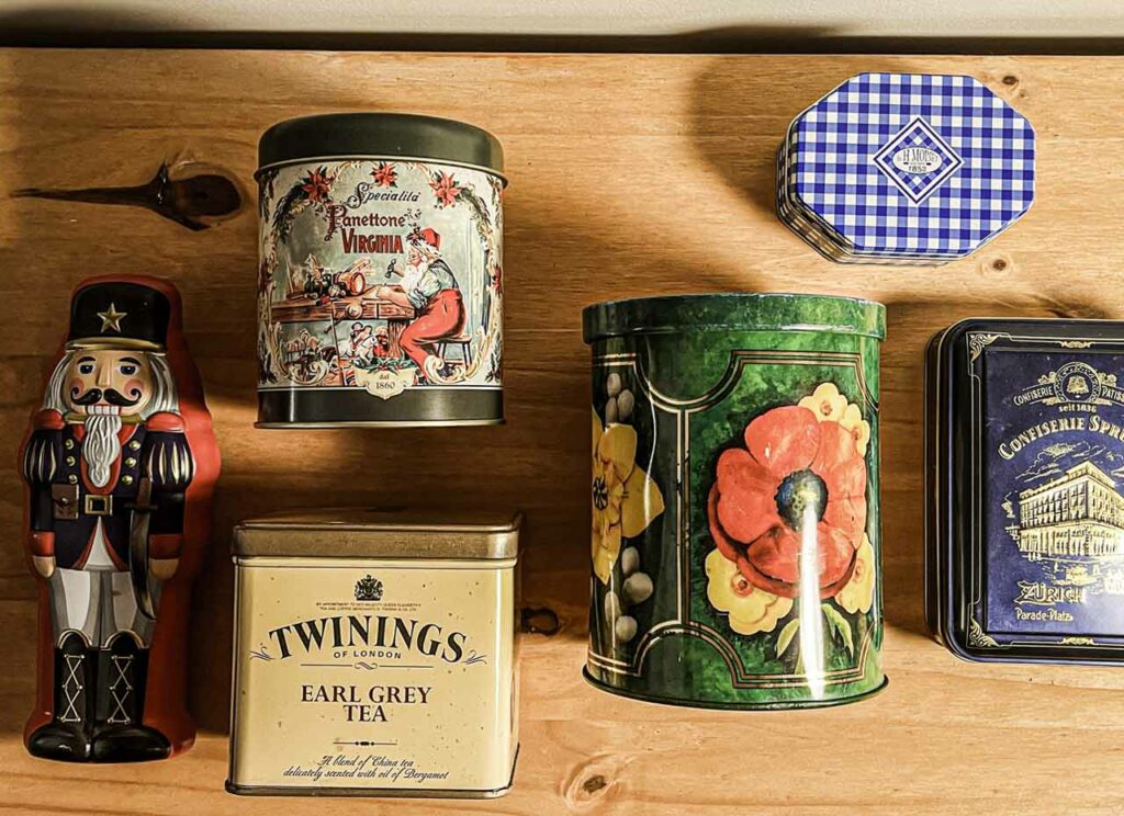 Stacks of little containers, all meant for something else. kept for no reason but beauty, or memory, or maybe just their soft metallic sound when opened.