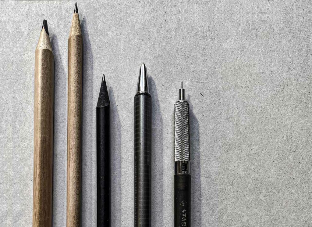 Graphite offers its voice in many forms. In (NØ)'s studio, soft wooden pencils sit beside the clean geometry of mechanical ones.